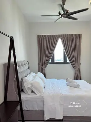 a bedroom with a bed with a ceiling fan at Meritus Residence 4min to Penang Bridge in Perai
