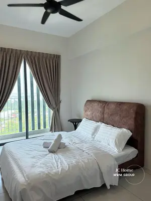 a bedroom with a bed with a ceiling fan at Meritus Residence 4min to Penang Bridge in Perai
