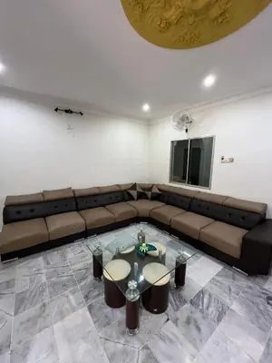 a living room with a couch and a table at KKB Gathering Home - Private Room in Shared House in Kuala Kubu Baharu