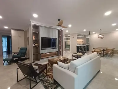 a living room with a white couch and a tv at Hejau Golf Villa in Tanah Rata