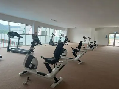 a gym with several tread machines in a room at Stay at Anderson Condo1615 Ipoh Town in Ipoh