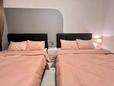 two beds sitting next to each other in a room at Stay at Anderson Condo1615 Ipoh Town in Ipoh