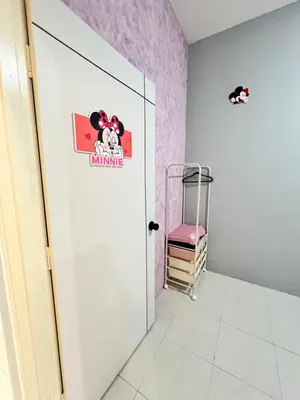 a room with a door with a hello kitty sticker on it at Love Mickey Cameron Highlands in Cameron Highlands