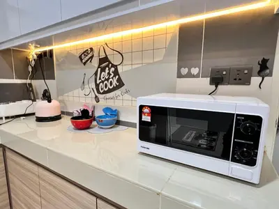a kitchen with a microwave on a counter at Love Mickey Cameron Highlands in Cameron Highlands