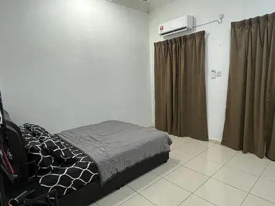 a bedroom with a bed in a room at Ummu Homestay 03 in Batu Gajah