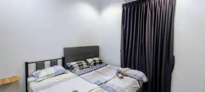 a bedroom with a bed with a black headboard and curtains at 18pax Bungalow Homestay Hutan Melintang in Hutan Melintang