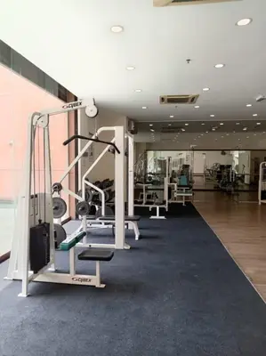 a gym with treadmills and machines in a building at Kuala Lumpur Residence At Hotel Times square in Gua Sai
