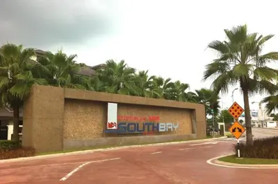 a sign on the side of a building with palm trees at home sweet home in Kampong Batu Maung