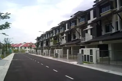 an empty street next to a building at home sweet home in Kampong Batu Maung
