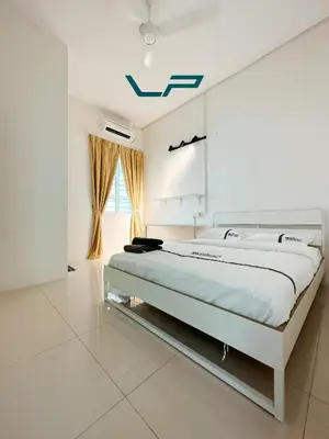 a white bedroom with a large bed in it at Penang Balik Pulau BBQ & KARAOKE Home in Balik Pulau