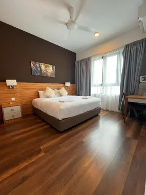 a bedroom with a bed and a ceiling fan at Sunway Onsen Ipoh by EUcation Home in Tambun