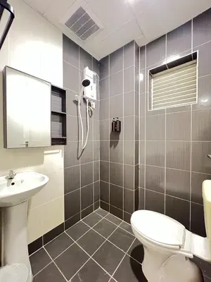 a bathroom with a toilet and a sink at Hotel Istanaku , Ipoh, Perak in Ipoh