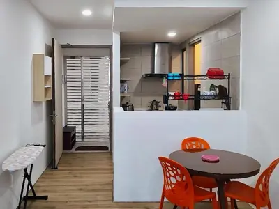 a kitchen and dining room with a table and chairs at #2 Hann's Residence Homestay Sunset View 2R2B in Gua Sai