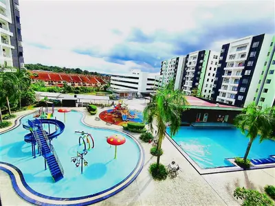 a large swimming pool with a water park at Ipoh Manhattan Waterpark Suite by City Home Empire MHA306 in Ipoh