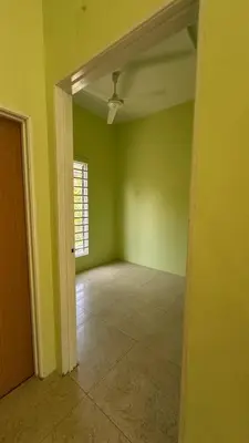 an empty room with green walls and a ceiling at Baitul Ilmi Homestay in Kuala Kangsar