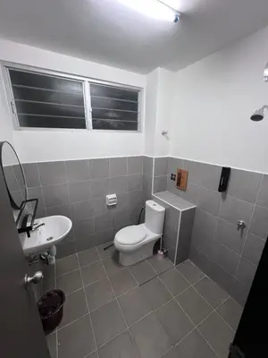 a bathroom with a toilet and a sink at berTIGA Homestay Bertam in Kepala Batas
