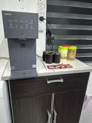 a coffee machine sitting on top of a counter at Syaf Homestay in Lunas