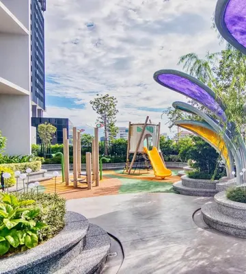 a park with a slide and a playground at Urban Studio 22Macalisterz- Washer and Nespresso in George Town