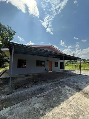 a small white building with a red roof at Homestay Maahad Tahfiz Kemukjizatan Al-Quran in Gerik