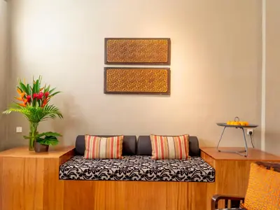 a living room with a couch and a table at Argus Residences in George Town