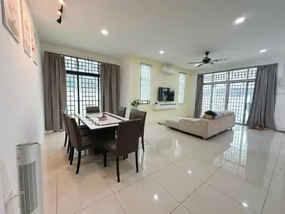 a living room with a table and a couch at ipoh setia homestay in Ipoh