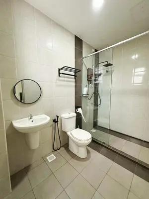 a bathroom with a shower and a toilet and a sink at ipoh setia homestay in Ipoh