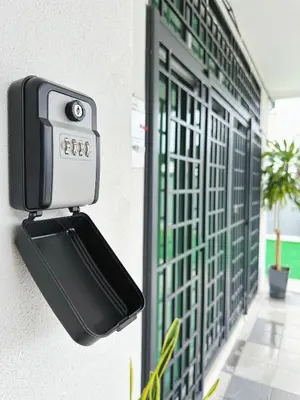 a security camera on the side of a building at ipoh setia homestay in Ipoh