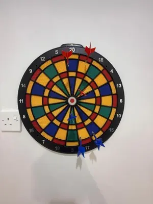 a colorful dartboard on a wall at Cozy Family Home Seberang Jaya in Kampong Bagan Dalam