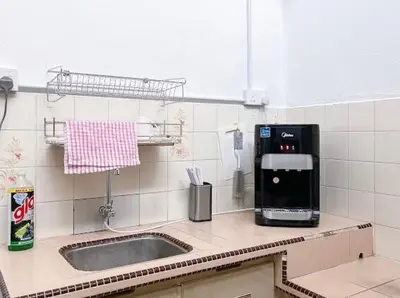 a kitchen with a sink and a coffee maker at Pearl Cottage - 2min Drive to Lam Wah Ee Hospital in George Town
