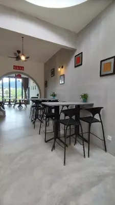 a row of tables in a room with chairs at Sunya Home Ground Floor Raub Pahang in Raub