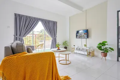 a living room with a couch and a tv at Perfect for Families & Friends, Retreat Brinchang Cameron Highland- Clover Home 2-20 in Brinchang