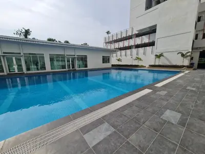 a swimming pool in front of a building at The Anderson by Triple G Homes in Ipoh