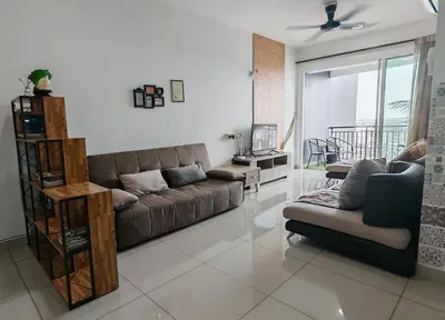 a living room with a couch and a table at The Legend Menara Majestic in Gua Sai