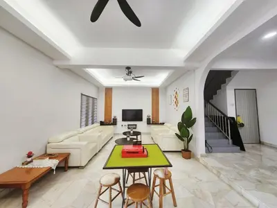 a living room with a couch and a table at Ipoh town7br5bath 25 pax pool table mahjong karaok in Ipoh