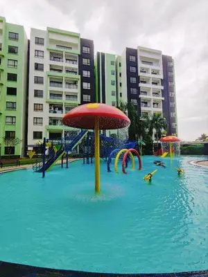 a water park with a water slide and an umbrella at Ipoh Manhattan Waterpark Suite by City Home Empire MHB403 in Ipoh