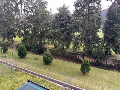an overhead view of a garden with trees and a fence at Mossy Green Golfcourse Homestay in Tanah Rata