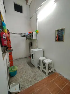 a bathroom with a toilet and two stools in it at RZ HOMESTAY With WiFi in Sungai Siput