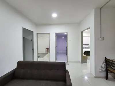 a living room with a couch and a bedroom at Family Haven at Paragon in Gua Sai