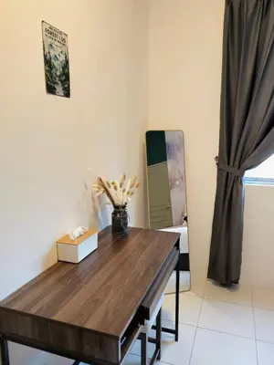 a room with a wooden table and a mirror at #MyHillsideHideaway at Quintet, Cameron Highlands in Tanah Rata