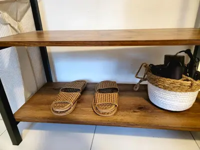 two pairs of slippers on a shelf with a basket at #MyHillsideHideaway at Quintet, Cameron Highlands in Tanah Rata