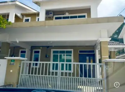 a house with a white fence and a porch at Healing Homestay in Kampong Changkat Sedonan