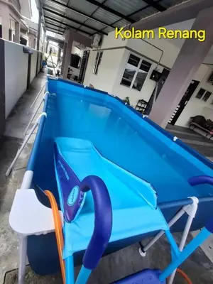 a blue pool table with a chair next to it at 1132 D' KHASIEH Homestay in Kampong Sungai Wangi Dalam