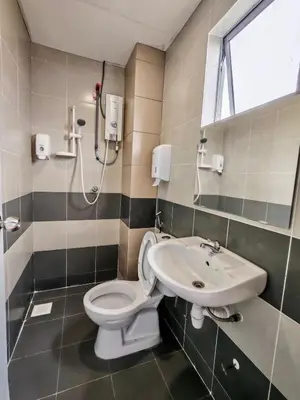 a bathroom with a toilet and a sink at DawnBlue Cameron Highlands in Brinchang