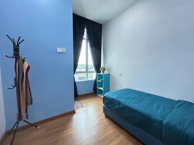 a blue bedroom with a bed and a window at Sky Garden Ipoh Comfortable Homestay 6-7pax SY27 in Chemor