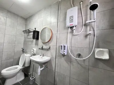 a bathroom with a shower with a toilet and a sink at FY Perumahan Makmur TR Jaya Tanah Rata in Tanah Rata