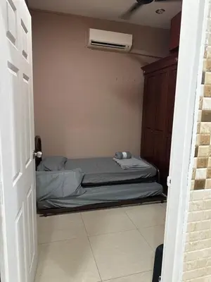 a small bedroom with a bed and a air conditioner at MM Homestay 80 in Kamunting