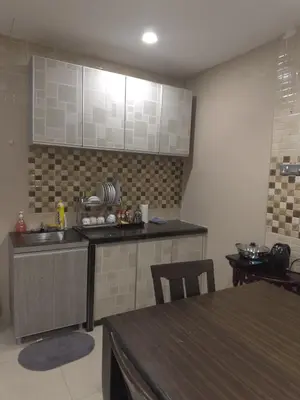 a kitchen with a sink and a counter top at MM Homestay 80 in Kamunting