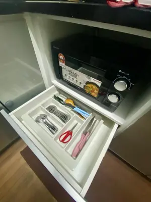 a small refrigerator with its door open with food inside at Syahoney Homestay 2 with NETFLIX in Tanah Rata