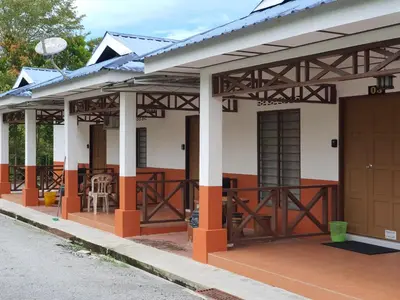 a small house with orange and white at D Tasek Homestay Lenggong