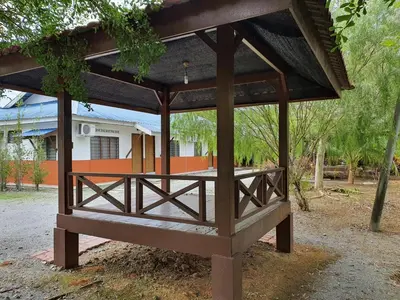 a wooden pavilion in front of a house at D Tasek Homestay Lenggong